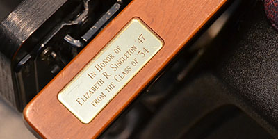 auditorium seat with plaque in honor of an alumni