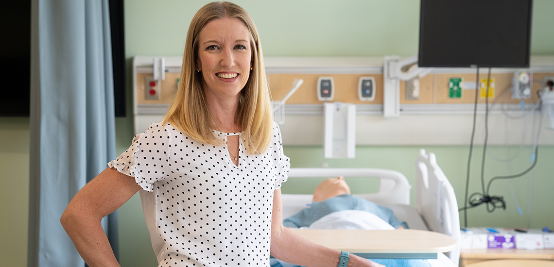 Stephanie Harrison poses in a sim lab