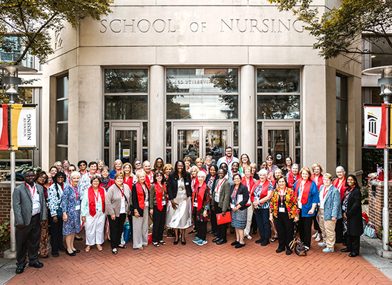 A group photo of the reunion attendees outside the UMSON building