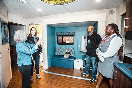 Veronica Gutchell giving a tour of a Sim lab