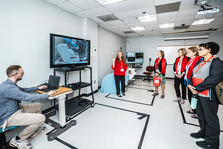 Amy Daniels giving a tour of a sim lab