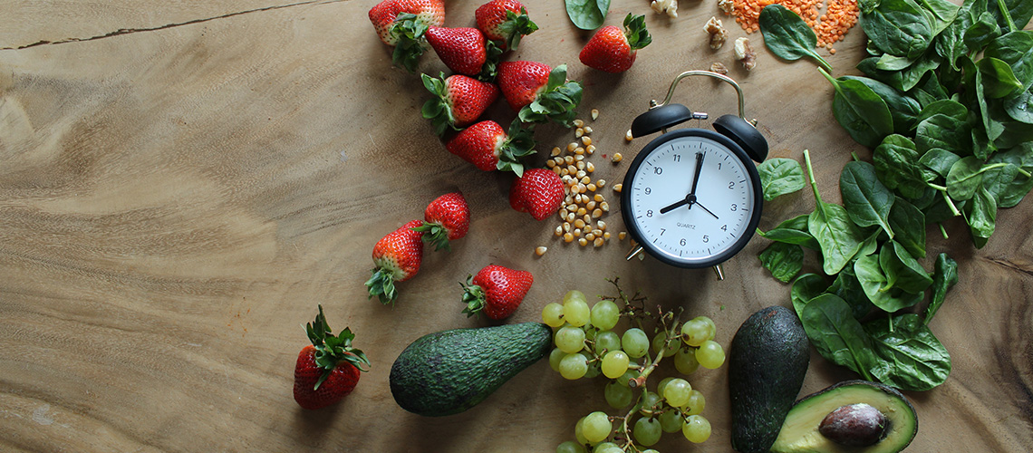 Fruits and veggies with an alarm clock