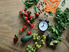 Fruits and veggies with an alarm clock